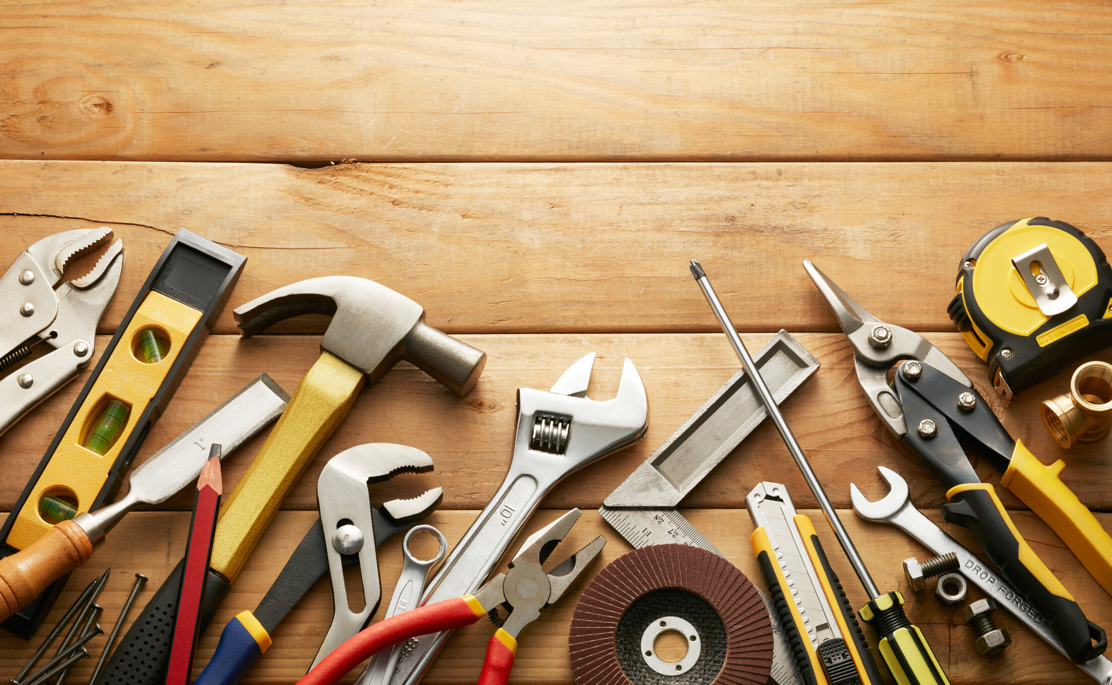 variety of tools on wood planks with copy space